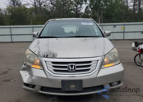 2009 Honda Odyssey Touring z USA, uszkodzony, nr VIN 5FNRL389X9B003277